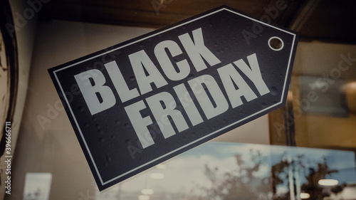 a sign in the store indicating the beginning of discounts. Black Friday