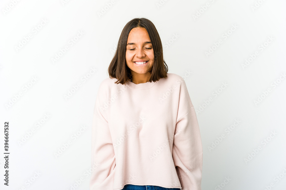Young mixed race woman laughs and closes eyes, feels relaxed and happy. Young mixed race woman laughs and closes eyes, feels relaxed and happy.