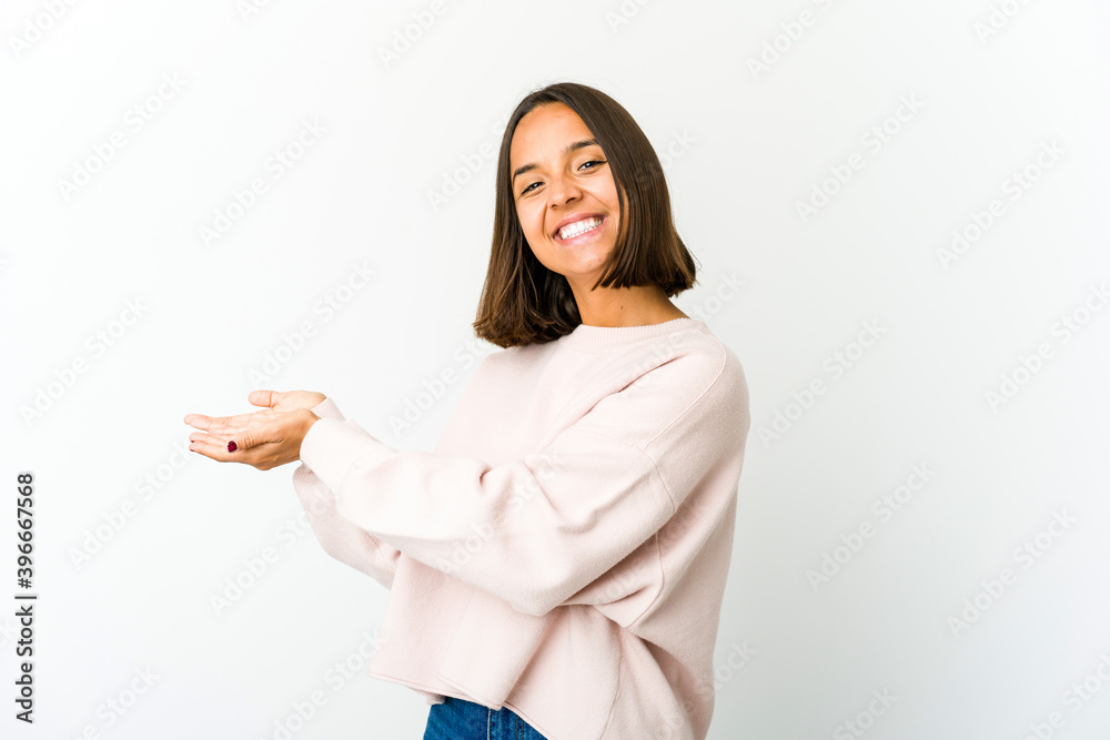 Young mixed race woman holding a copy space on a palm. Young mixed race woman holding a copy space on a palm.