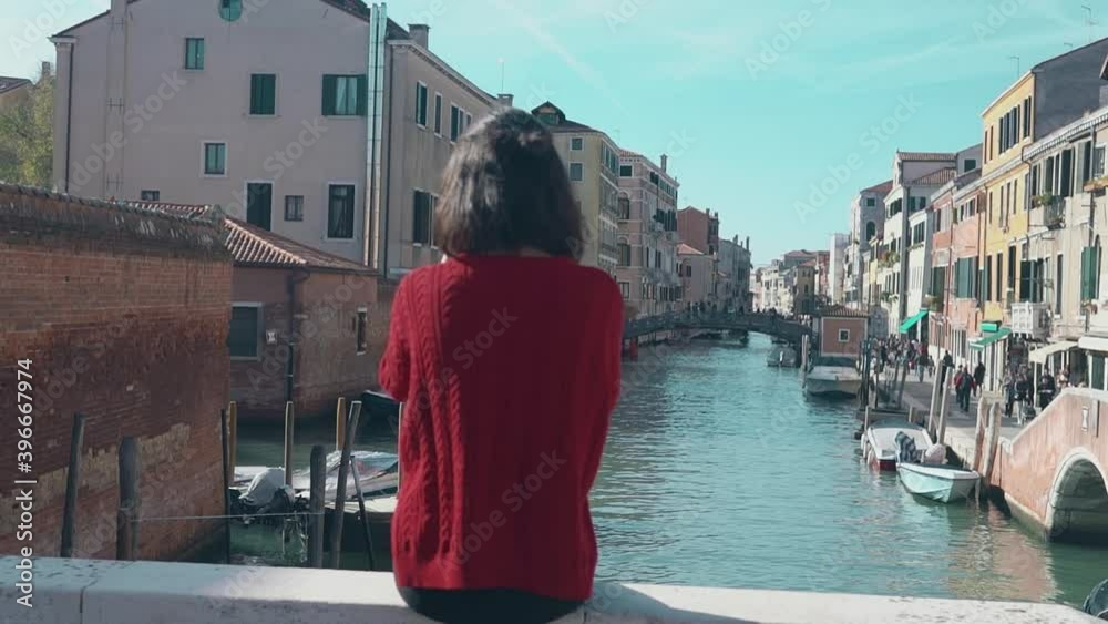 Having rest in the warm rays of the sun in Italy. Rear view of