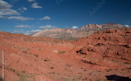 The red canyon. View of the arid desert, valley, sandstone, rocky formations and mountains under a deep blue sky in Talampaya national park in La Rioja, Argentina.