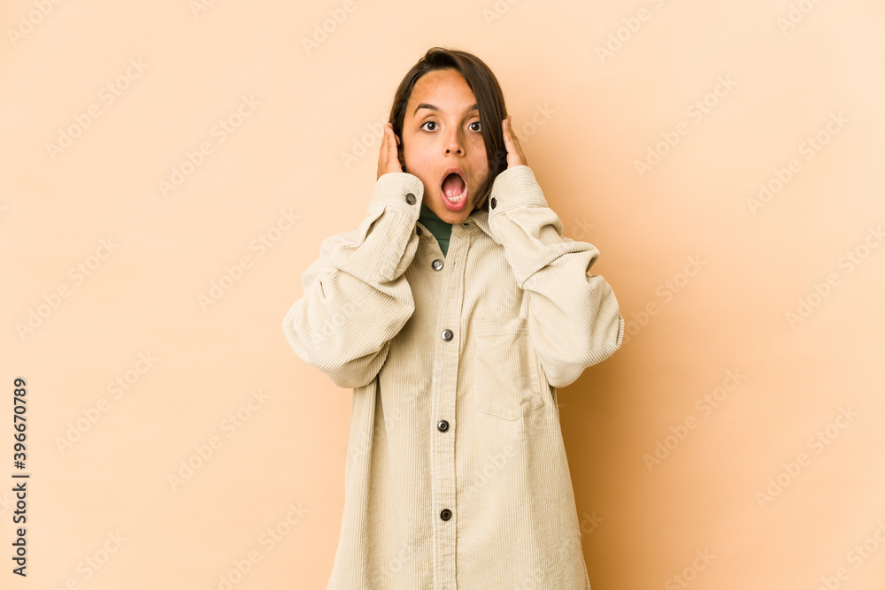 Young hispanic woman isolated screaming, very excited, passionate, satisfied with something. Young hispanic woman isolated screaming, very excited, passionate, satisfied with something.