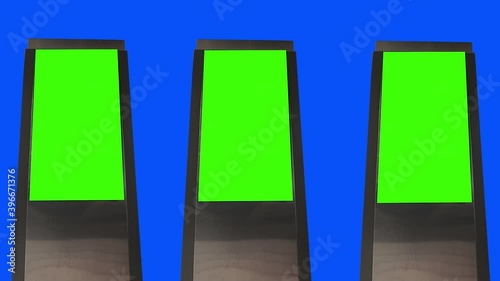 Choma key, 3D billboard mock-up. Blank banner with green screen, blue screen background. A few empty board. photo