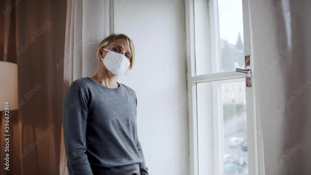 Woman indoors at home feeling stressed, mental health and coronavirus concept. Woman indoors at home feeling stressed, mental health and coronavirus concept.