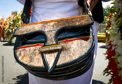 Carriel bag in the foreground. Flower Fair. Medellin, Antioquia, Colombia. photo