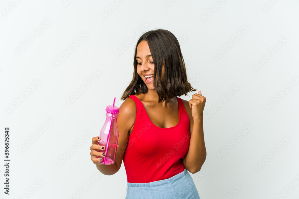 Young latin woman holding a milkshake isolated on white background Young latin woman holding a milkshake isolated on white background