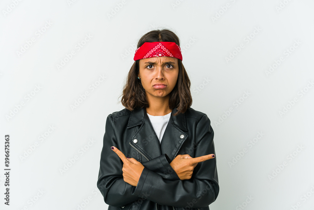Young latin rocker woman isolated on white background Young latin rocker woman isolated on white background