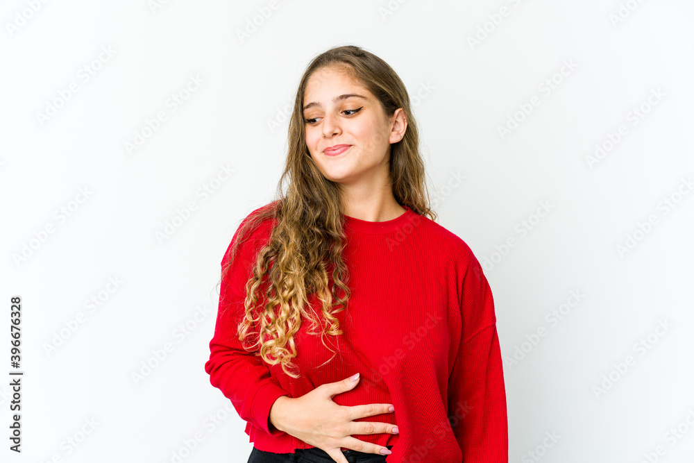 Young caucasian woman touches tummy, smiles gently, eating and satisfaction concept. Young caucasian woman touches tummy, smiles gently, eating and satisfaction concept.