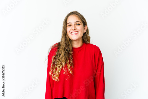 Young caucasian woman laughs and closes eyes, feels relaxed and happy. © Asier