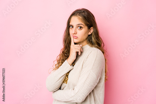 Young caucasian woman unhappy looking in camera with sarcastic expression.