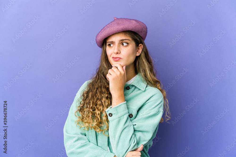 Young caucasian cute woman thinking and looking up, being reflective, contemplating, having a fantasy. Young caucasian cute woman thinking and looking up, being reflective, contemplating, having a fantasy.