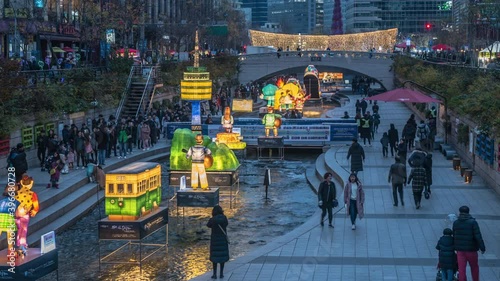 Seoul, South Korea - December 23, 2018: Cheonggyecheon stream, people walking on beautiful Christmas lights at night in Seoul, South Korea