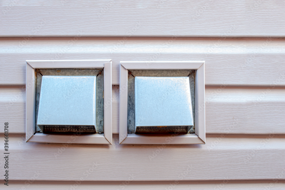 Fototapeta premium Front view air wall cap. Vent cap outside building. Furnace duct outside of a residencial house