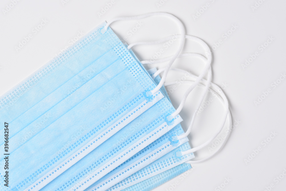 Closeup of a group of medical masks on a white background. Closeup of a group of medical masks on a white background.