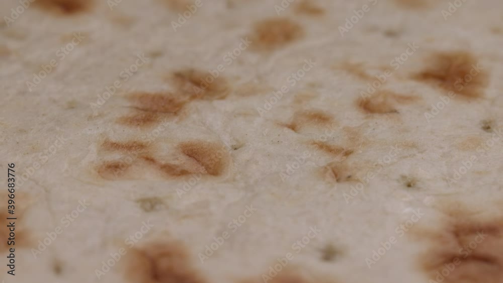 Close up uptopped baked flatbread pizza round Close up uptopped baked flatbread pizza round