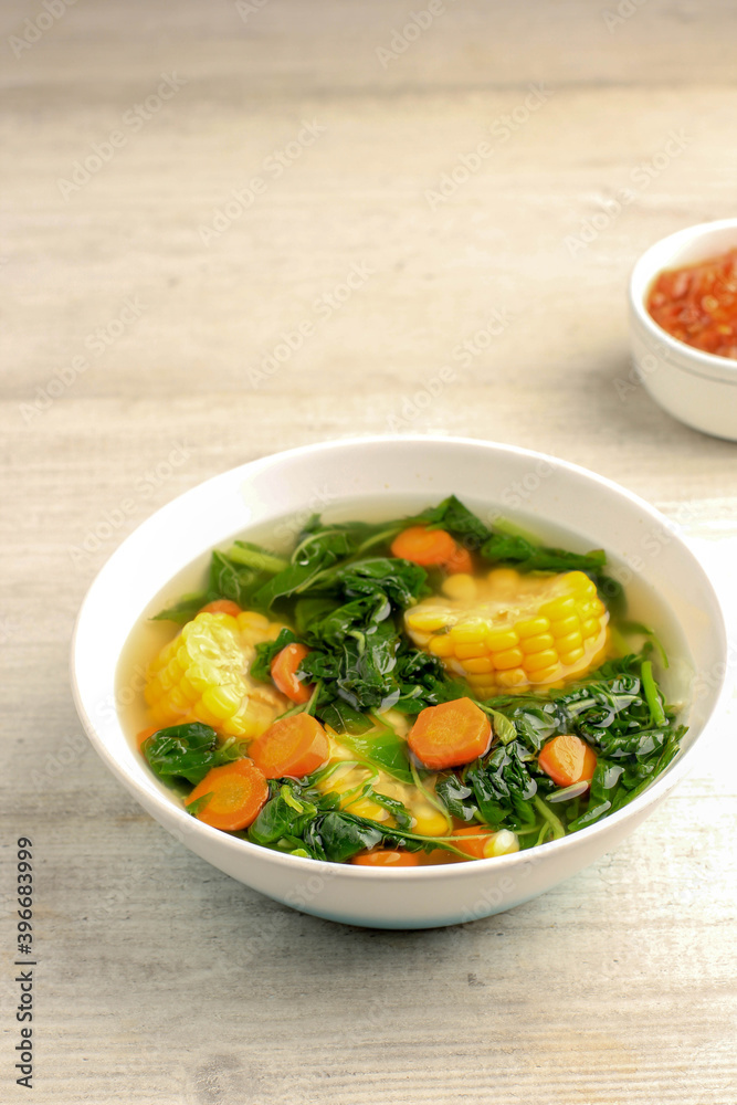 Sayur Bening Bayam is Daily Menu in Indonesian family, made from Spinach, Carrot, and Corn. Spiced with Garlic and Salt. Served with Various Side Dish like Tofu or Fried Salted Fish and Sambal. Sayur Bening Bayam is Daily Menu in Indonesian family, made from Spinach, Carrot, and Corn. Spiced with Garlic and Salt. Served with Various Side Dish like Tofu or Fried Salted Fish and Sambal.