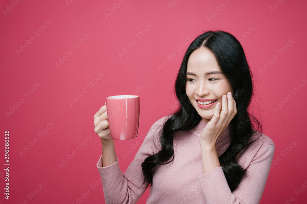 Portrait of asian woman holding coffee cup isolate on pink background. Portrait of asian woman holding coffee cup isolate on pink background.