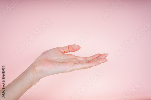 Woman barehand isolate on pink background.