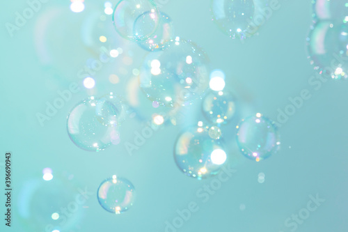 Beautiful shiny transparent soap bubbles float texture background. freshness natural summer background.