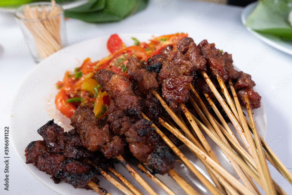 One of the typically Indonesian foods is satay or sate. This food is made from beef or mutton or chicken which is grilled over smoky coals then served with peanut sauce and soy sauce.