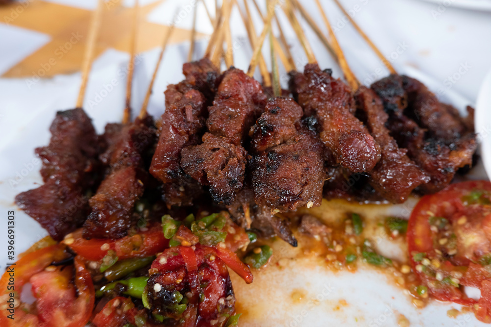 One of the typically Indonesian foods is satay or sate. This food is made from beef or mutton or chicken which is grilled over smoky coals then served with peanut sauce and soy sauce. One of the typically Indonesian foods is satay or sate. This food is made from beef or mutton or chicken which is grilled over smoky coals then served with peanut sauce and soy sauce.
