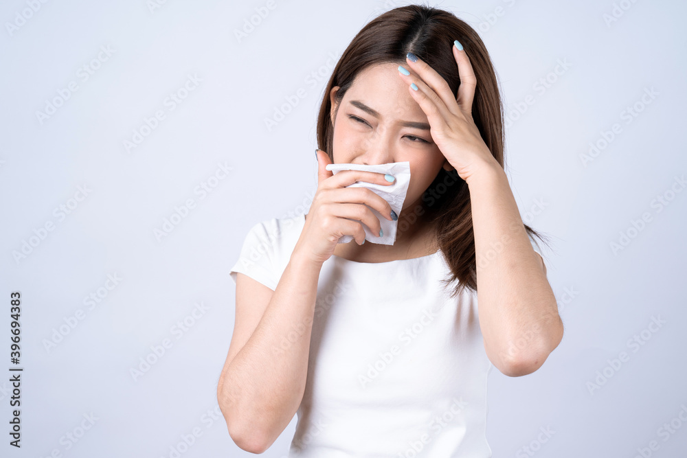 Asian woman sick with the flu, Isolated on white background. Asian woman sick with the flu, Isolated on white background.