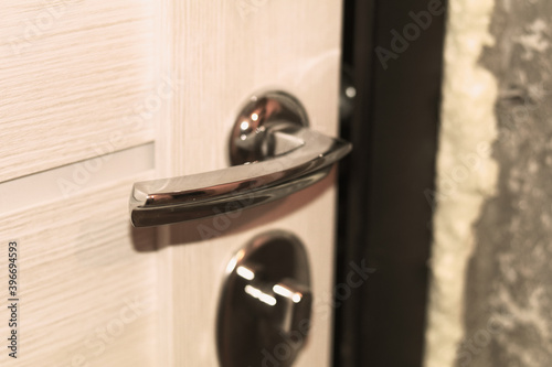 Doorknob and new door during apartment renovation
