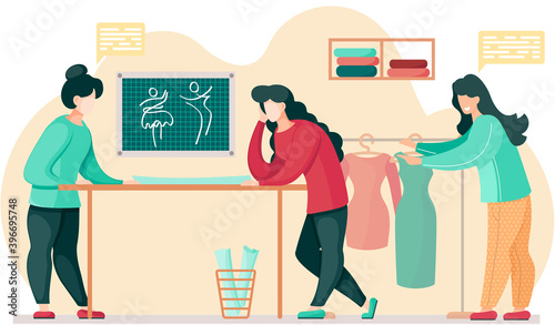 Designers in a studio planning design of future garment. Girl chooses a dress. Women communicate and work together. Preparation for tailoring and making clothes. Fashion designers in tailoring studio