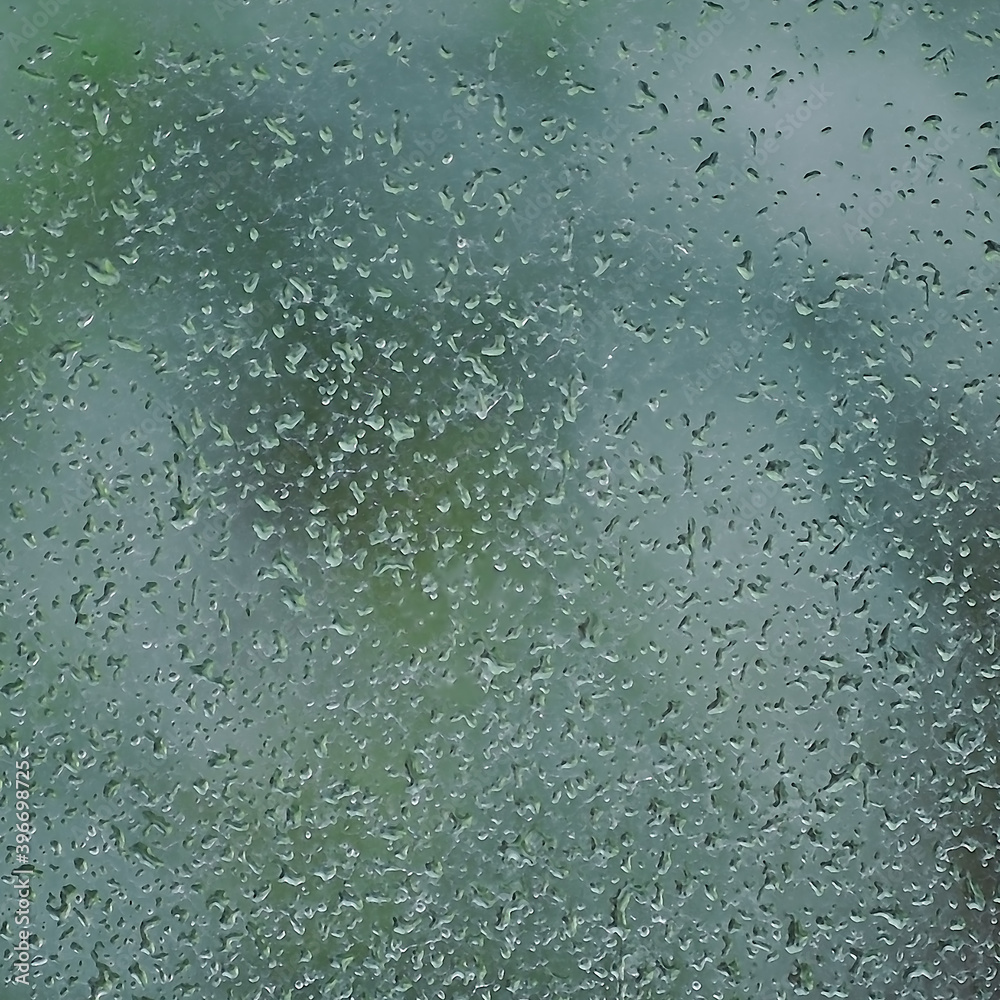 Rainy day, raindrops on wet window glass, vertical bright abstract rain water background pattern detail, macro closeup, detailed green, blue, dark vivid gray waterdrops, gentle bokeh, pluvial rainfall