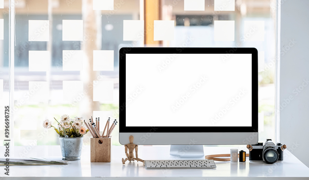 Mockup blank screen monitor and supplies on white wooden table. Mockup blank screen monitor and supplies on white wooden table.