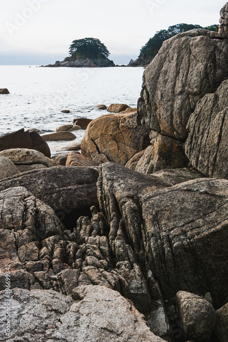 Rocky seashore, cloudy weather at sea, coastline of telyakovsky Bay Primorsky Krai, Russia. photo