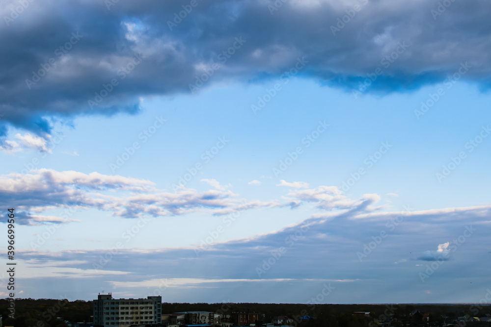 Dramatic dark cloudy sky over the horizon, natural blue background. Dramatic dark cloudy sky over the horizon, natural blue background.