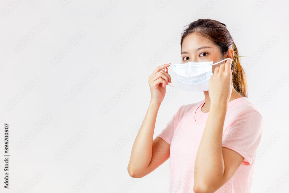 Asia woman wearing an anti virus protection mask to prevent others from corona COVID-19 on white background
Asia woman wearing an anti virus protection mask to prevent others from corona COVID-19 on white background
