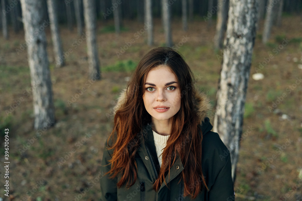 Woman in autumn jacket on nature in forest travel lifestyle Woman in autumn jacket on nature in forest travel lifestyle
