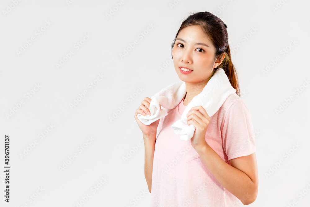 Asian woman holds a towel around her neck after exercising on white background Asian woman holds a towel around her neck after exercising on white background