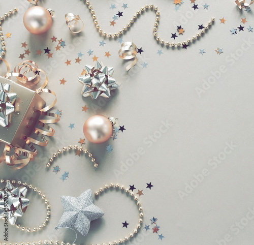 Christmas background . New Year decorations in gold colors frame on silver ba...