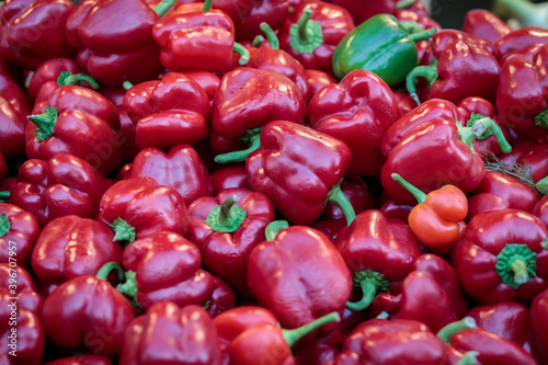 Background of sweet red peppers in a pile at the Mahane Yehuda market in Jerusalem