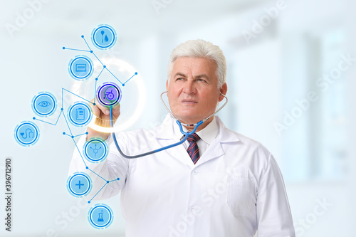 Mature male doctor with ste...