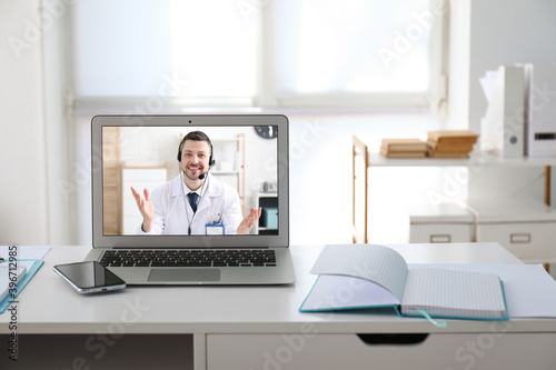Male doctor conducting onli...