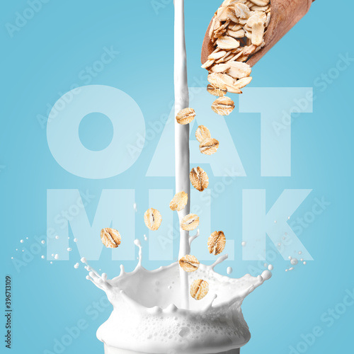 Splash of oat milk on color background photo