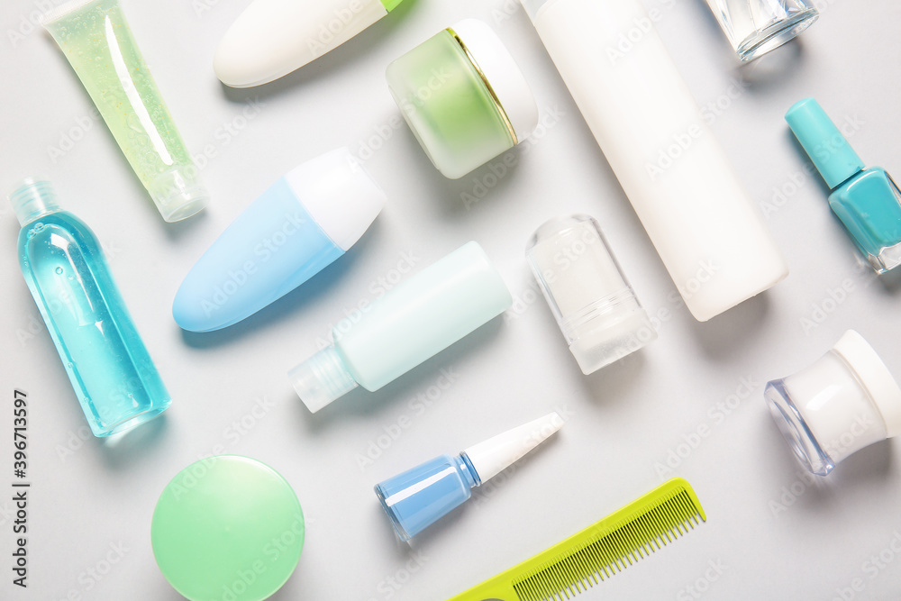 Fototapeta premium Travel cosmetics kit on light background