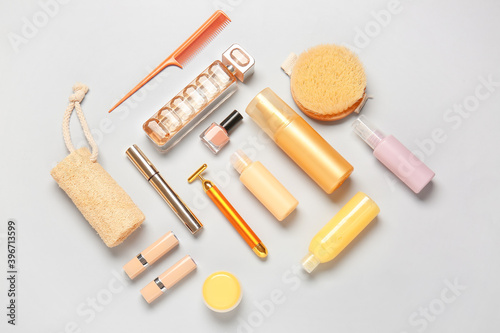 Travel cosmetics kit on light background