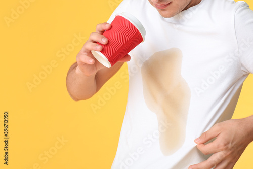 Stressed young man with cof...