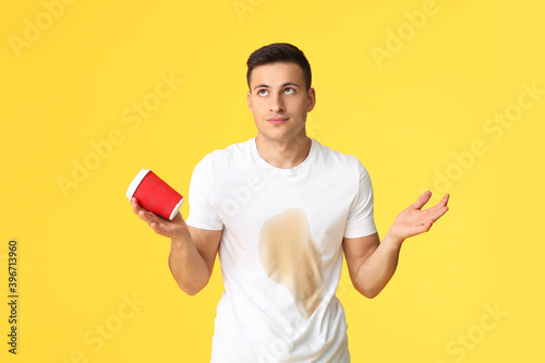 Confused young man with cof...