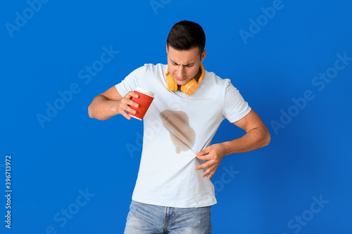 Stressed young man with cof...