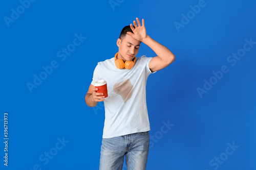 Stressed young man with cof...