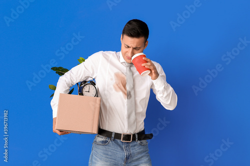 Young businessman with coff...