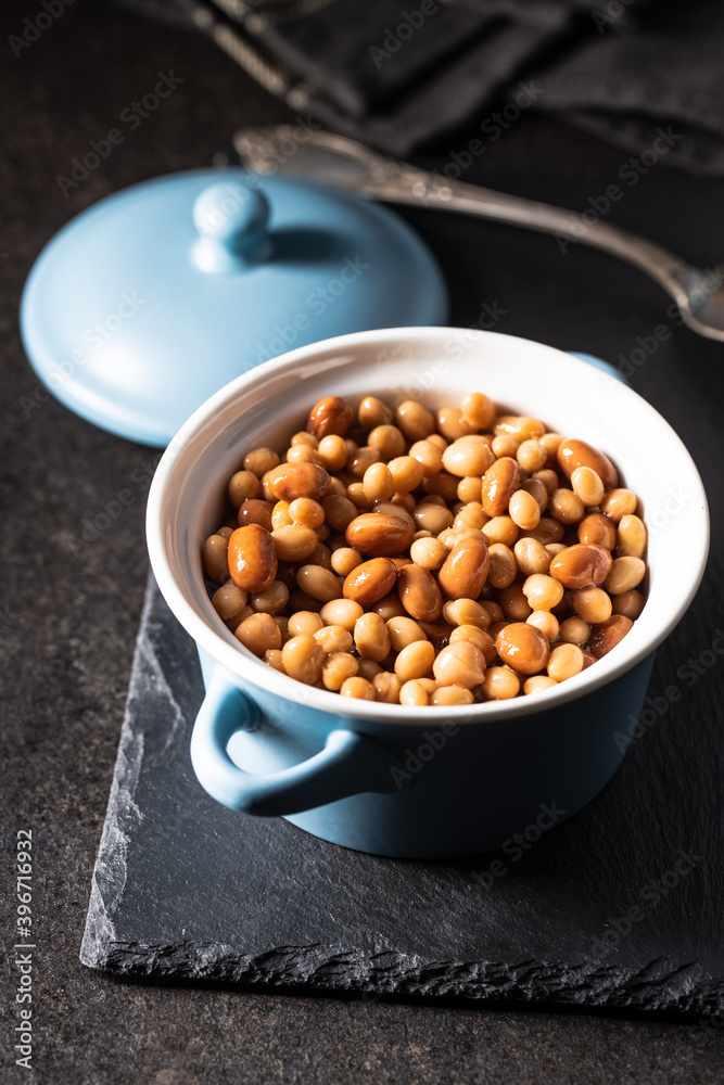 Mix of legume beans and chickpeas with sauce in pot. Mix of legume beans and chickpeas with sauce in pot.