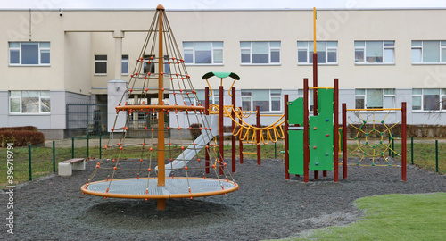Empty playground near city school