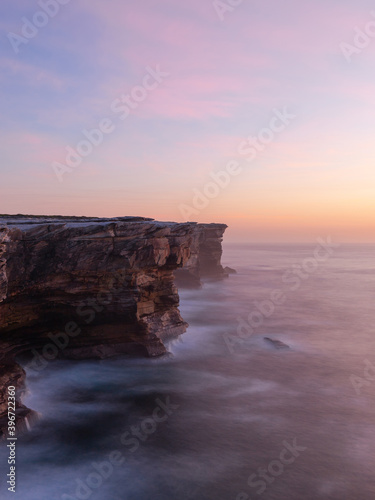 Sunrise view along the rock cliff at Sydney coastline, Australia.